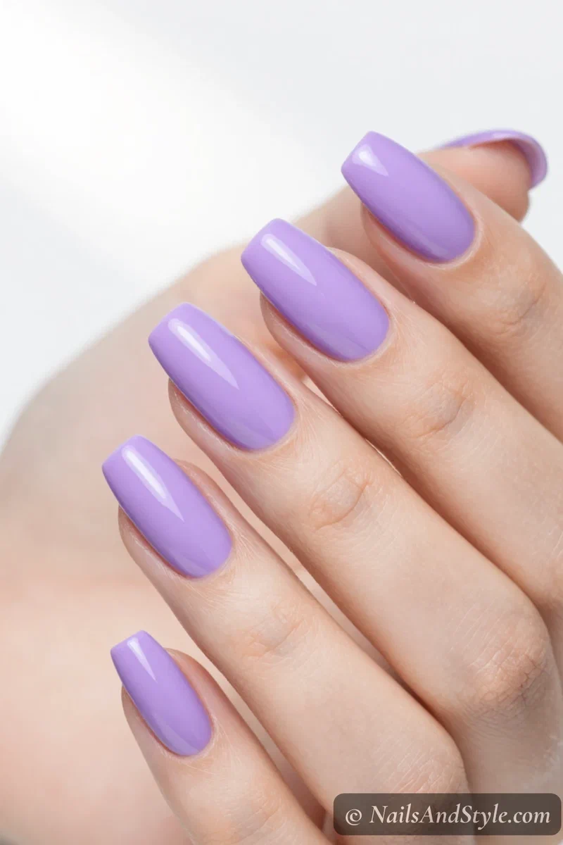 Bright saturated digital lavender nails with a glossy finish
