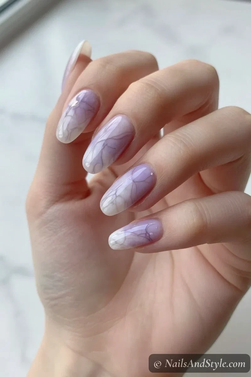 Lavender and white marble nails with soft veining