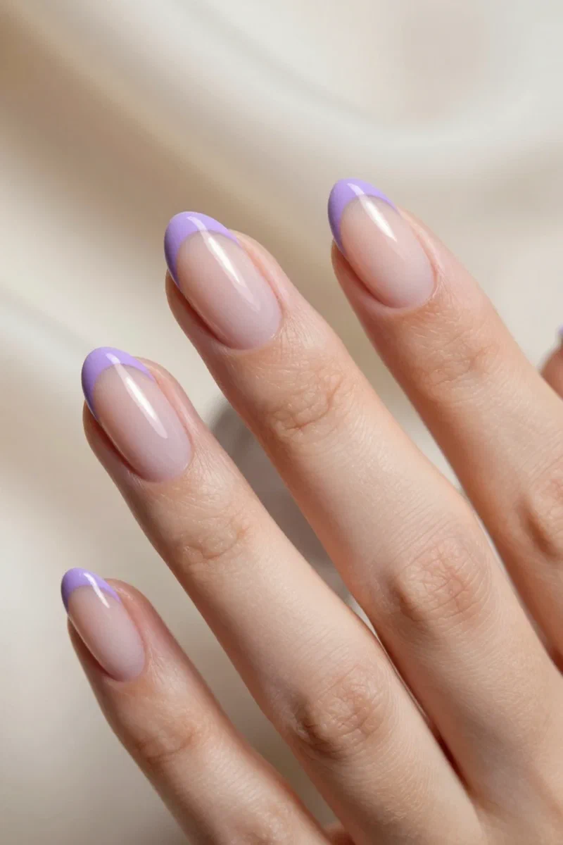 Sheer nails with a thin lavender micro-French tip
