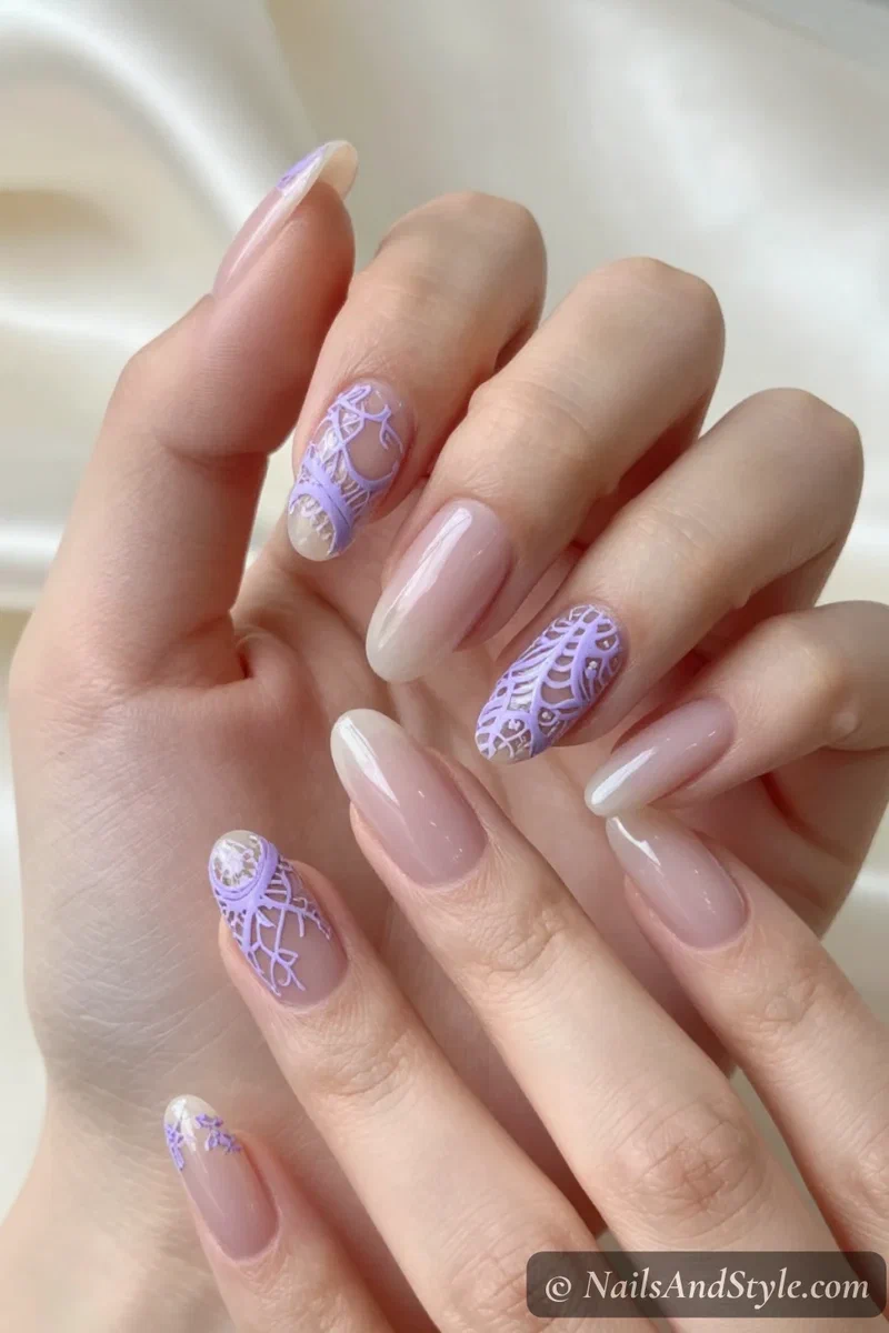 Negative-space nails with delicate lavender lace details