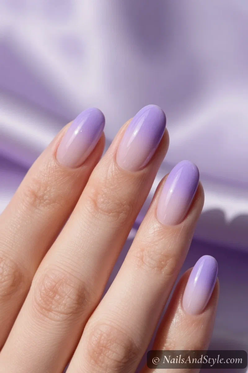 Lavender ombré nails fading from pale to deep purple