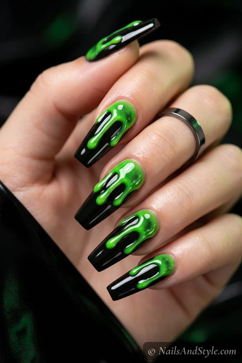 Long black nails with neon green slime dripping down