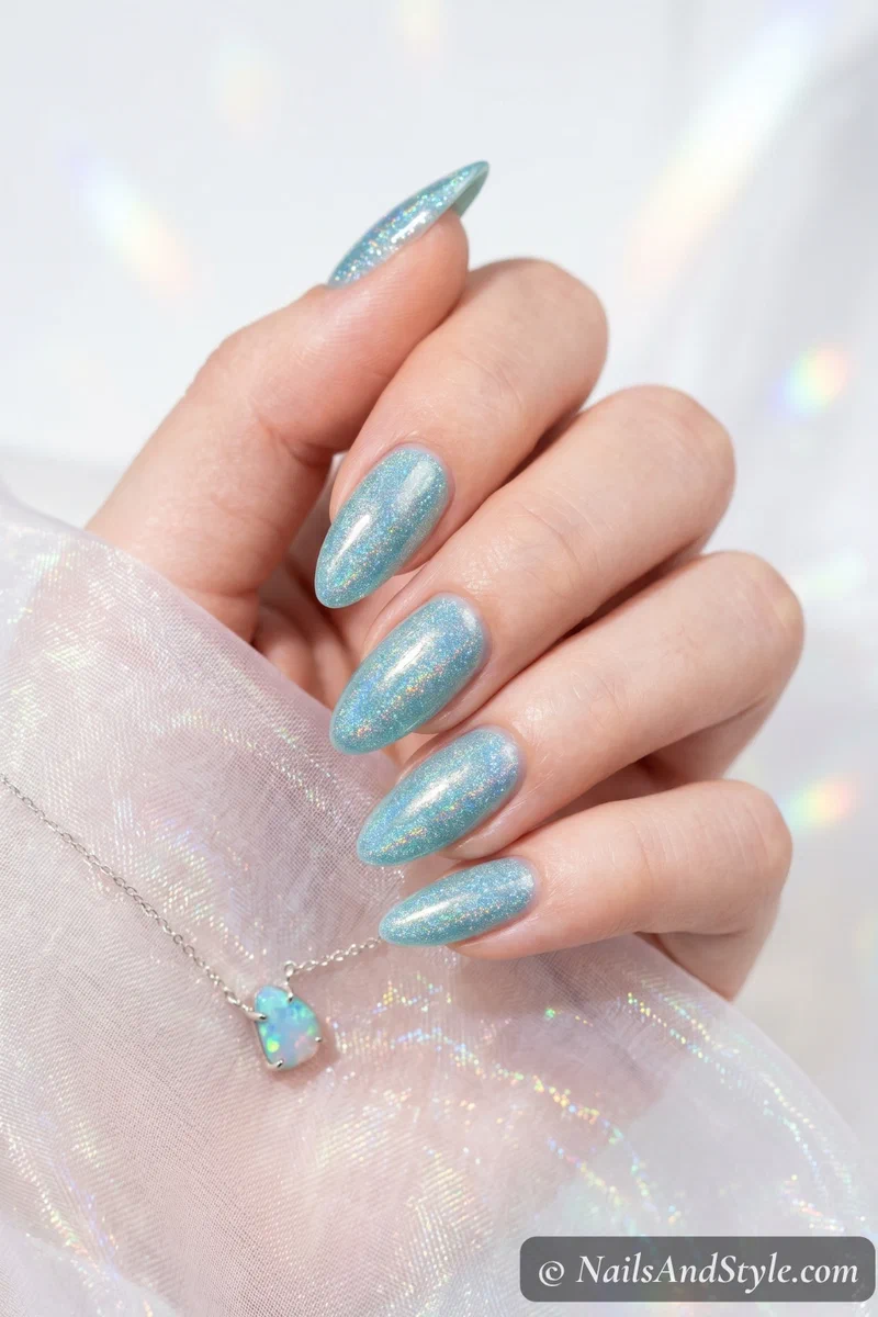 Holographic rainbow shimmer mermaid nails on aqua base