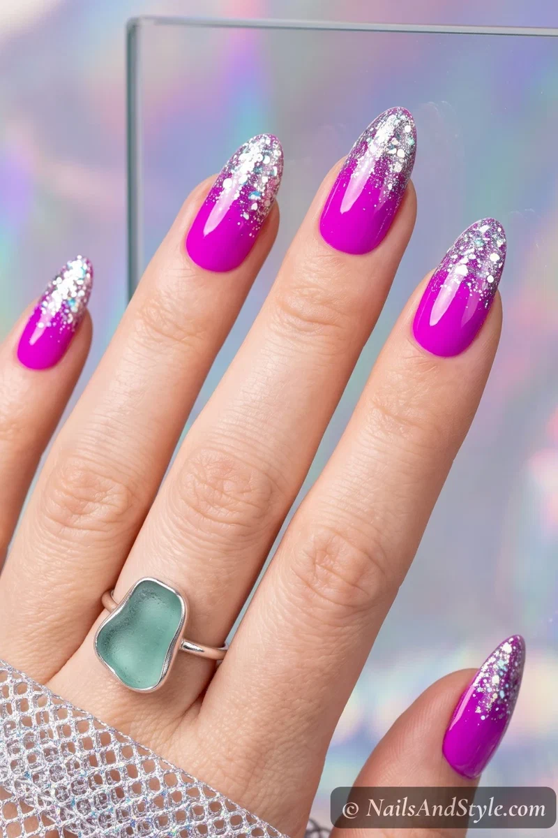 Neon magenta nails with iridescent glitter tips