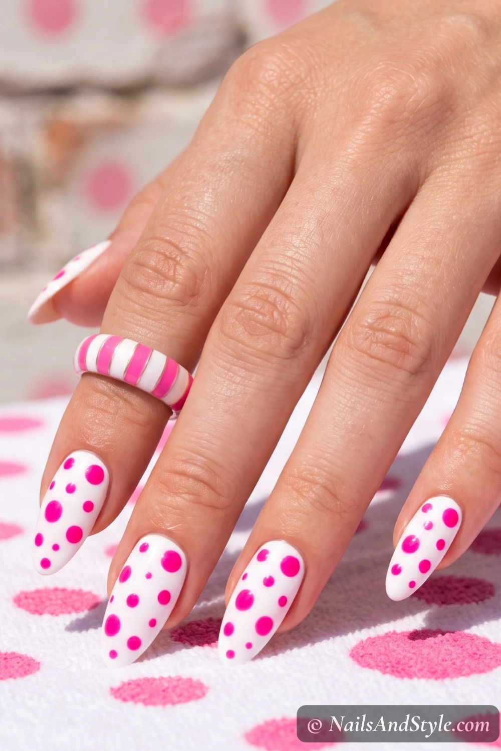 White nails with hot pink polka dots
