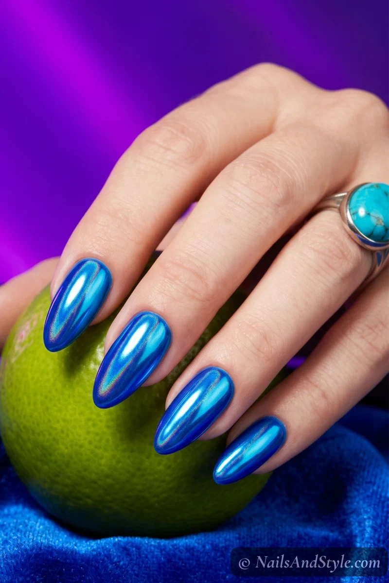 Neon blue chrome nails with metallic reflective finish