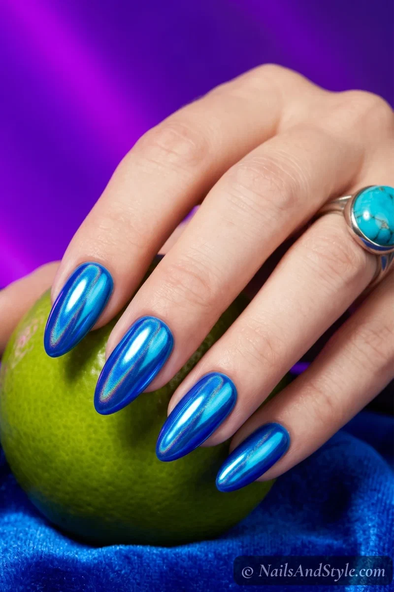 Neon blue chrome nails with metallic reflective finish