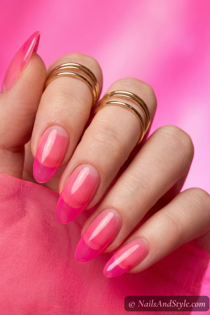 Sheer neon pink jelly nails with glossy candy-like finish