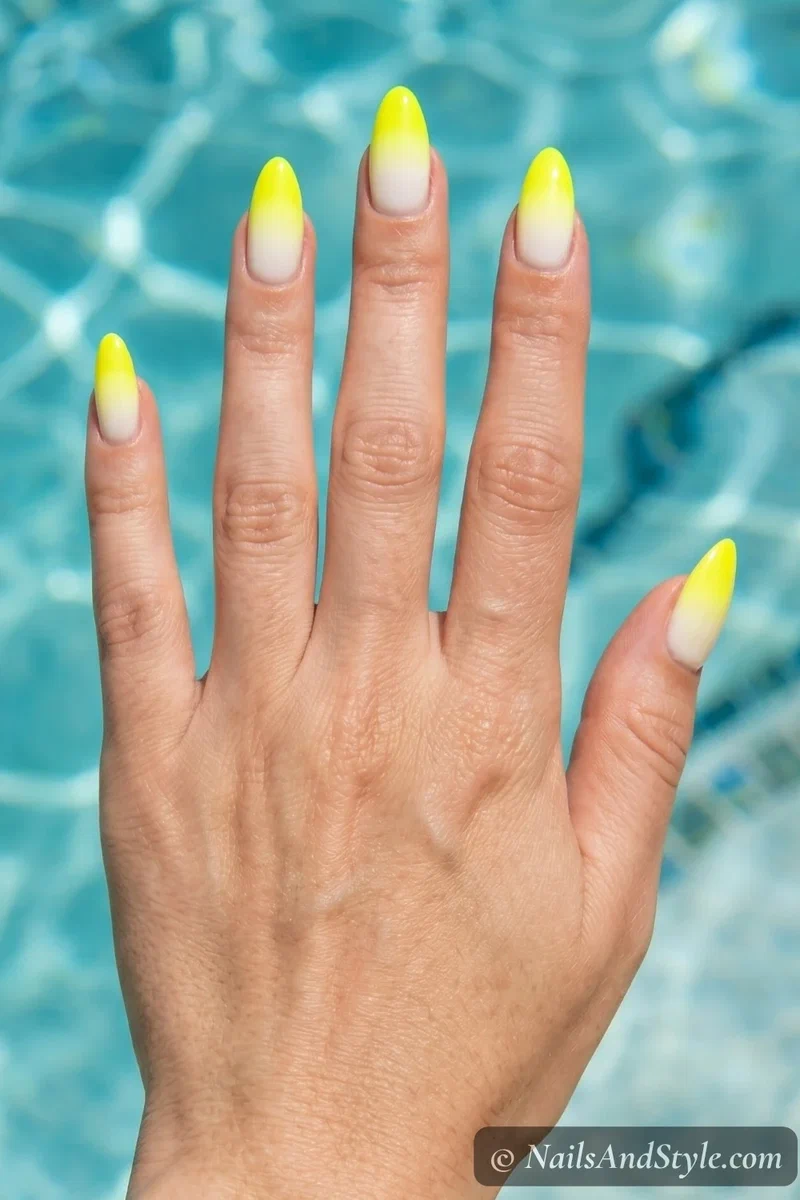 Neon yellow ombre gradient nails fading from white to bright yellow
