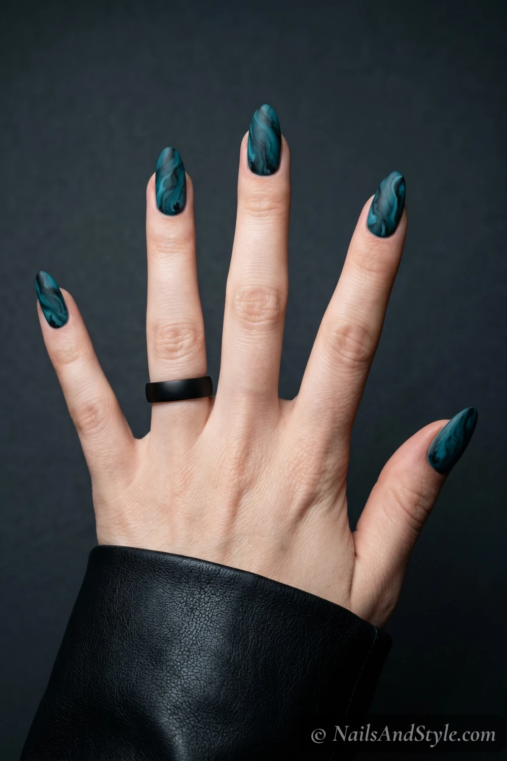 Matte teal and black ocean marble nails