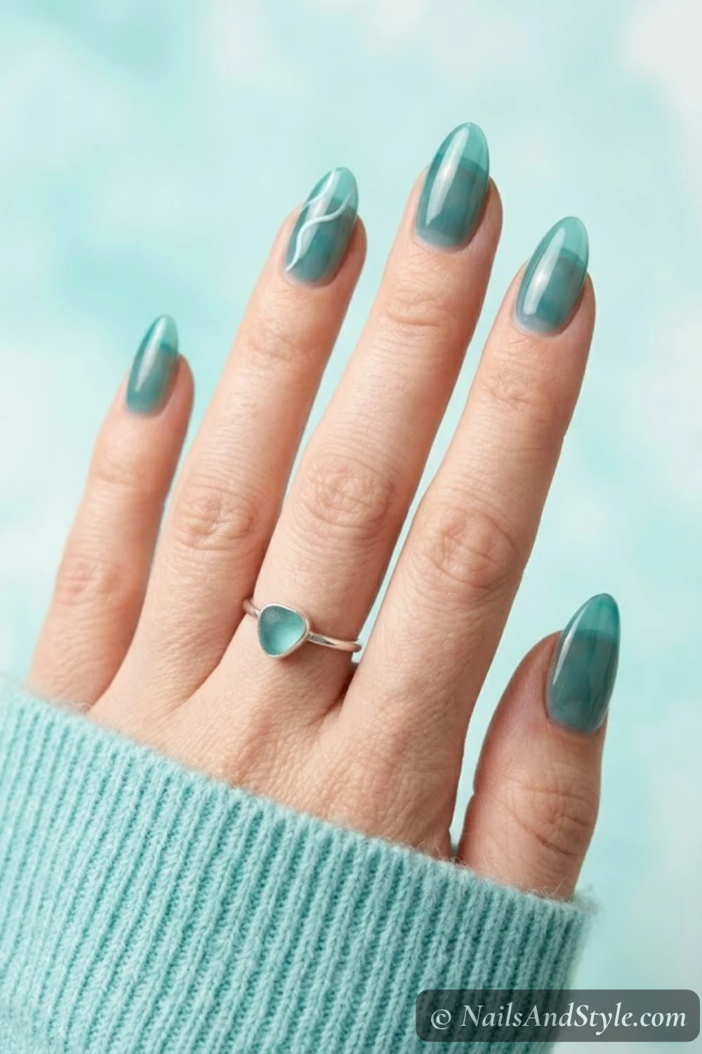 Sheer teal jelly nails with a white wave line