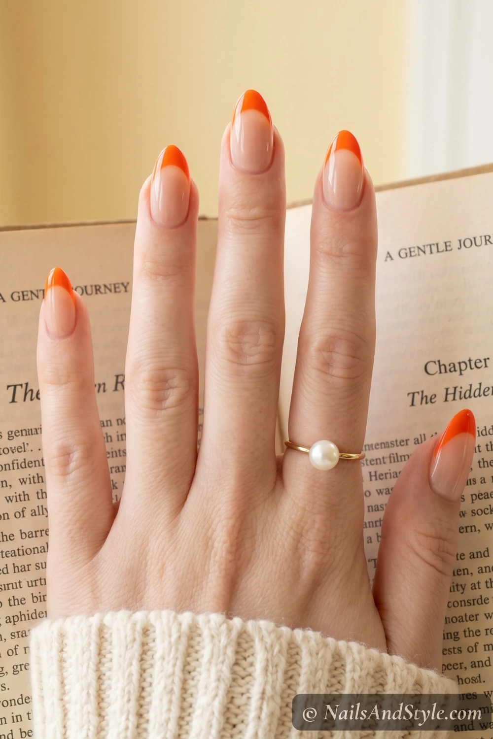 Bold orange French tip nails