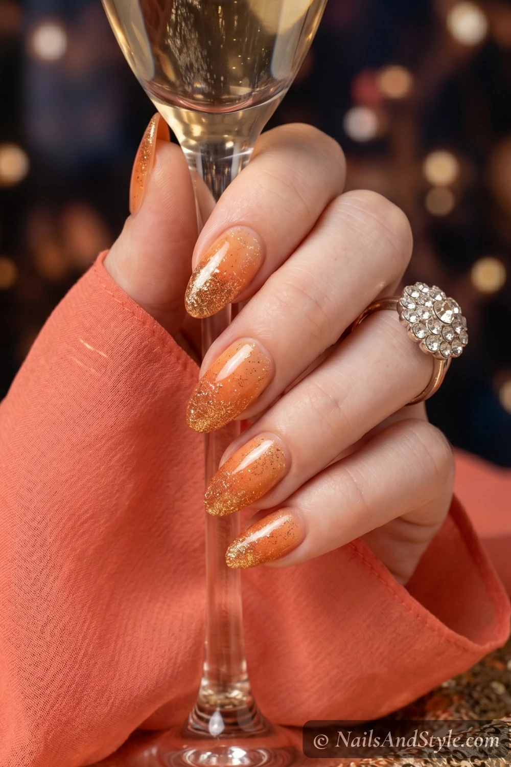 Orange glitter ombre nails