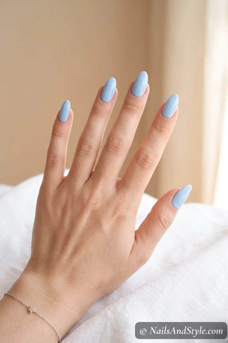 Clean solid baby blue nails with a glossy gel finish