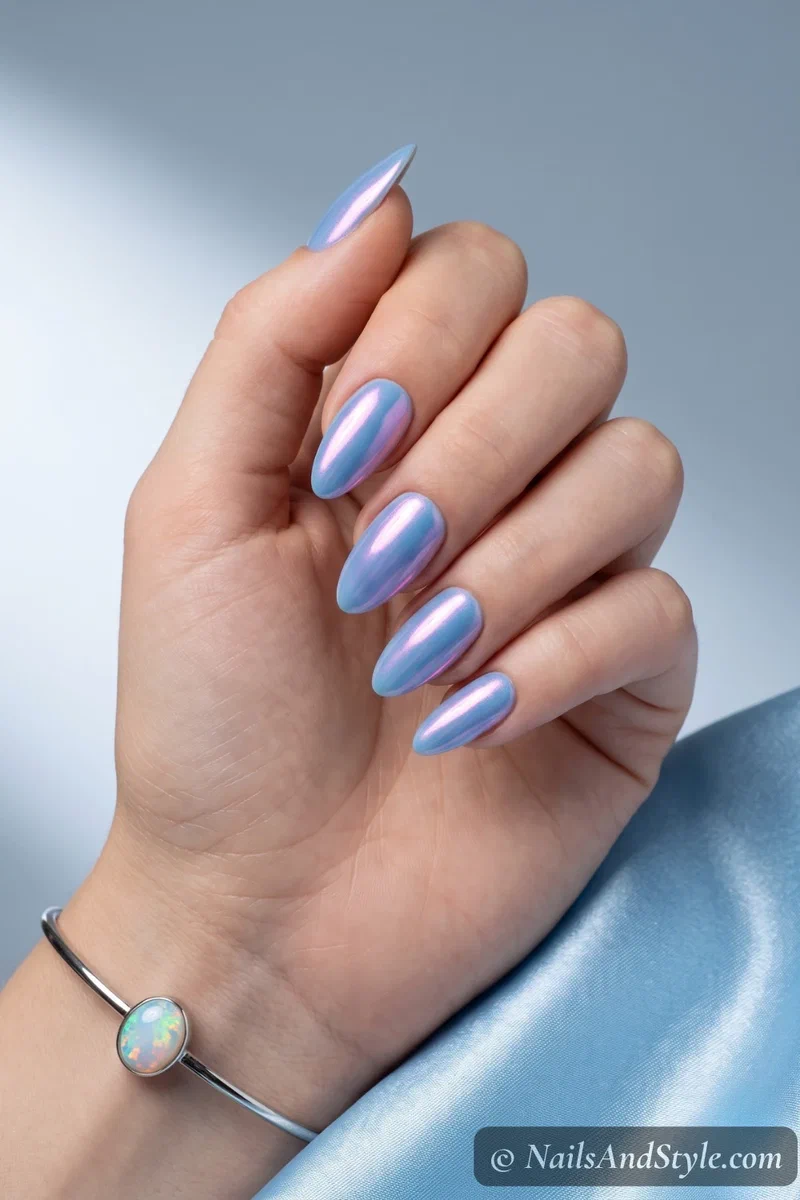 Powder blue chrome nails with iridescent color-shifting finish