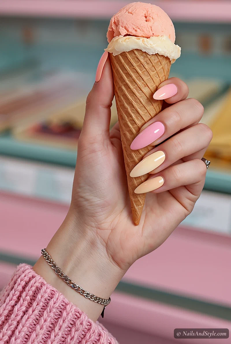 Pastel sorbet ombre nails fading from pink to peach to butter yellow