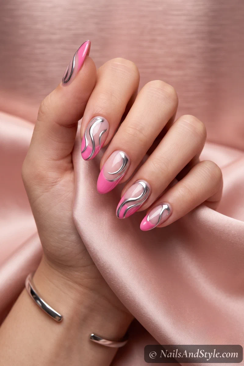 Pink French tips with liquid chrome swirls