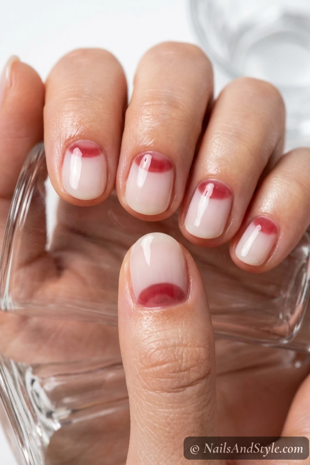 Milky nails with high-gloss translucent cherry-jelly half-moons