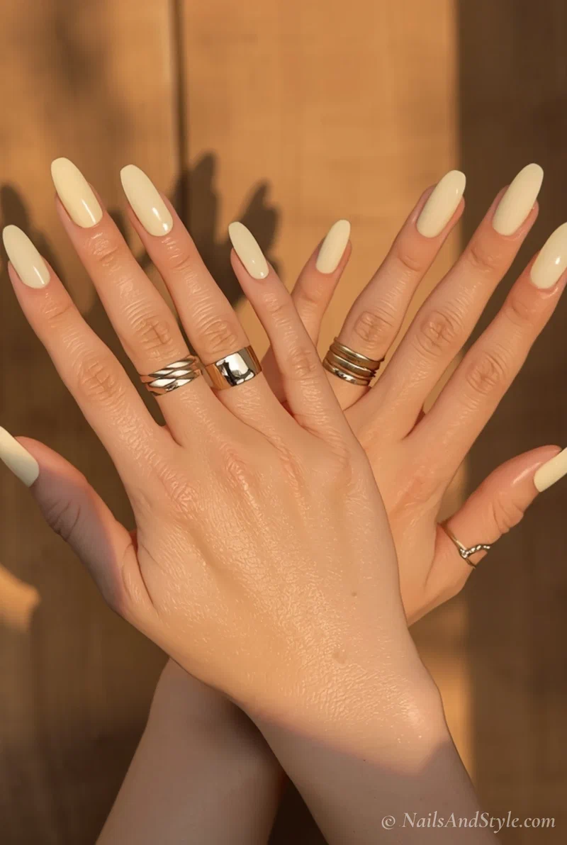 Butter yellow acrylic nails on short squoval shape