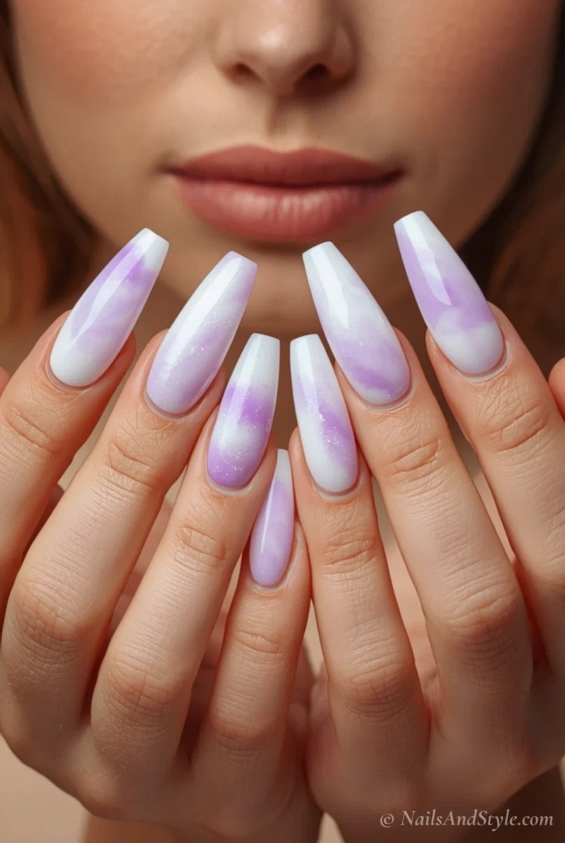 Lilac ombre acrylic nails on coffin shape blending into milky white base