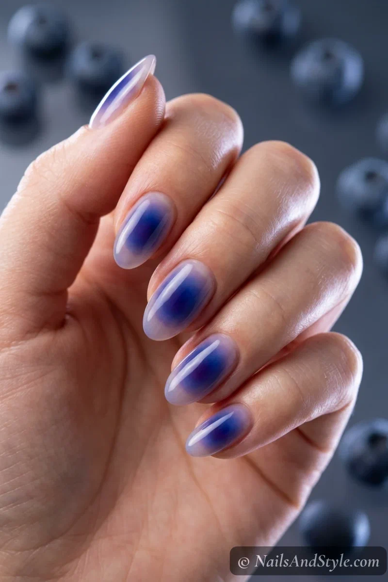 Deep blue to purple blueberry aura nails with a jelly finish