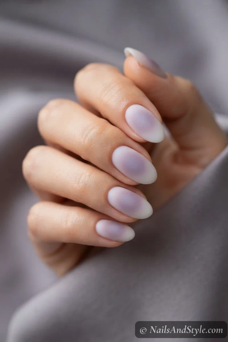 Dusty lavender aura nails with a soft matte finish