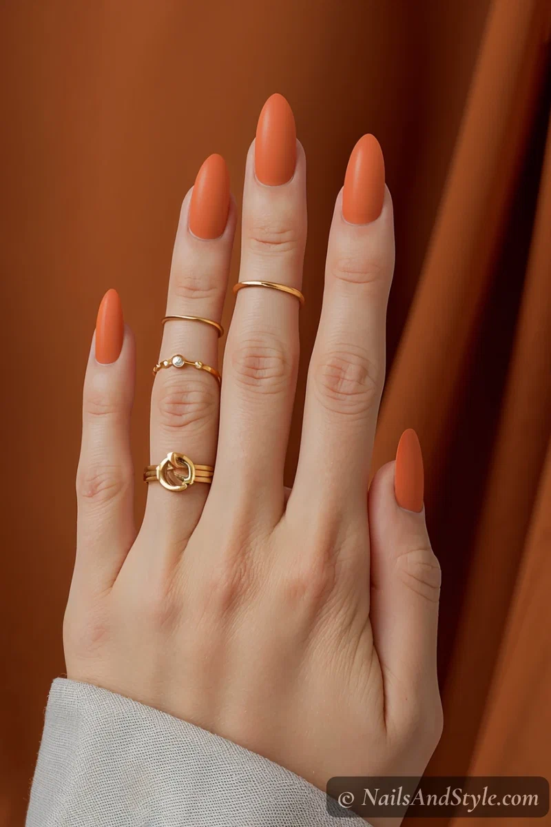 Bold fiery red to tangerine gradient nails on medium almond nails