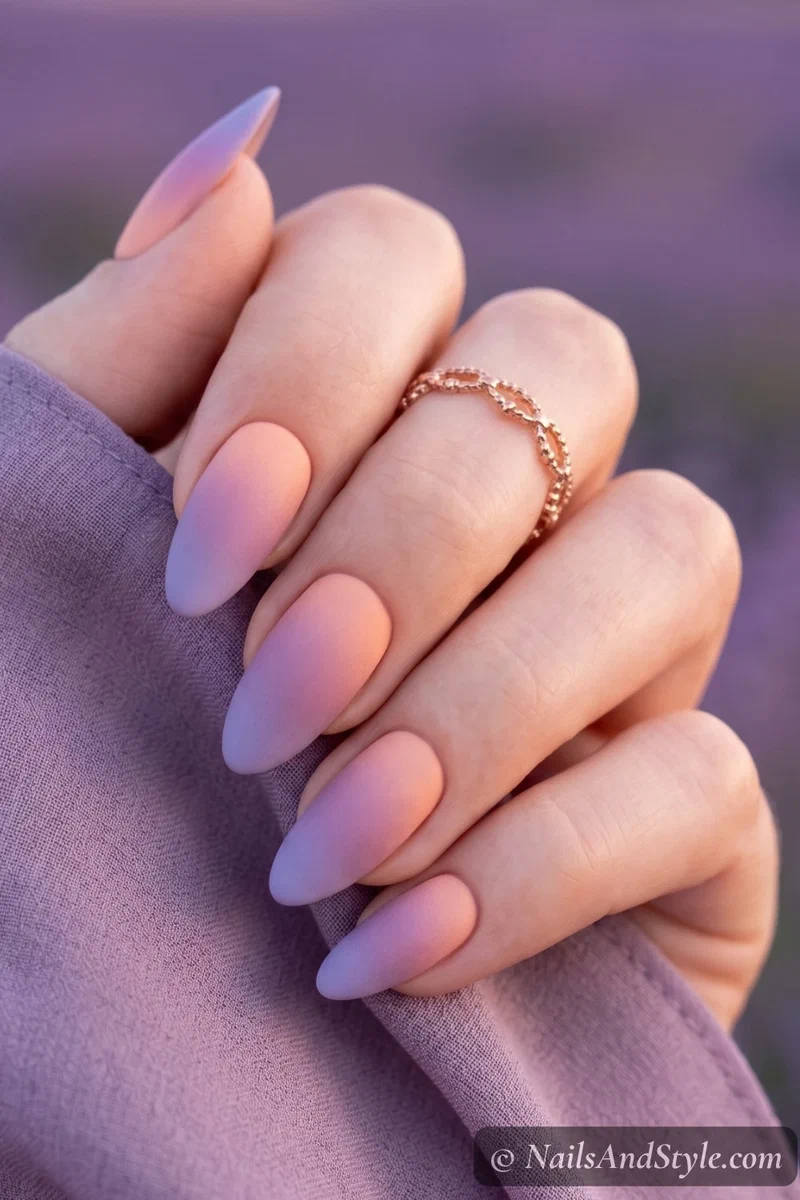 Peach and lavender twilight gradient nails with matte finish on almond nails