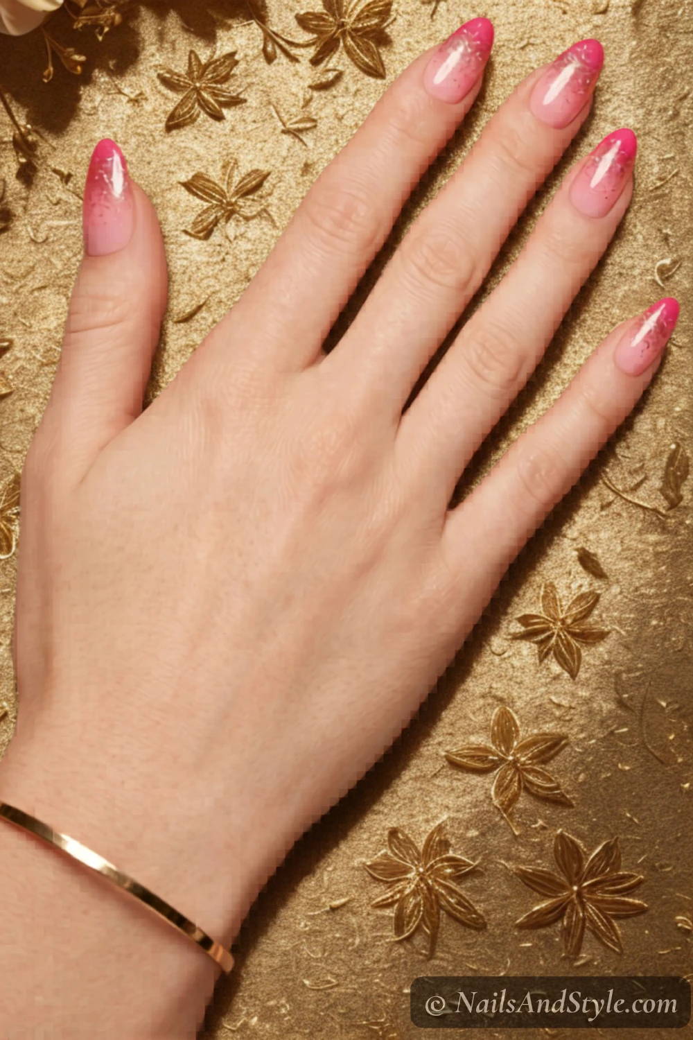 Pink sunset nails with gold glitter tips