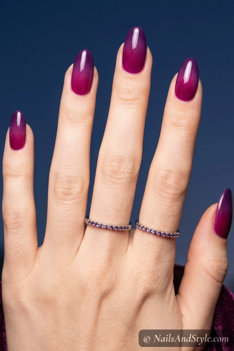 Purple to magenta dusk gradient nails with glossy finish on almond nails