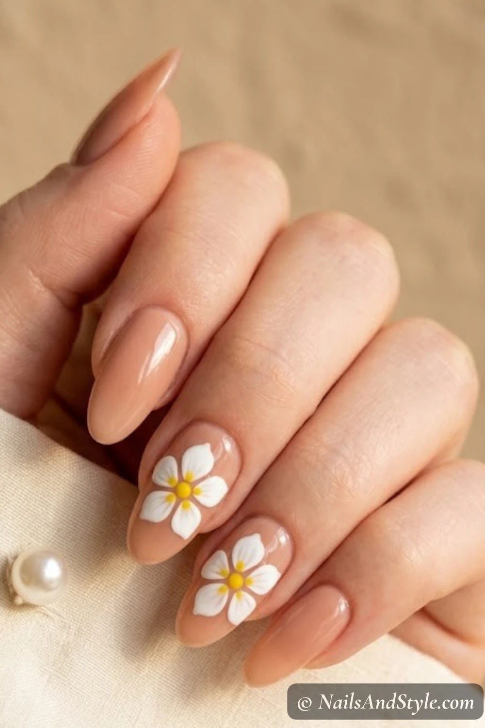 Nude nails with white plumeria flowers