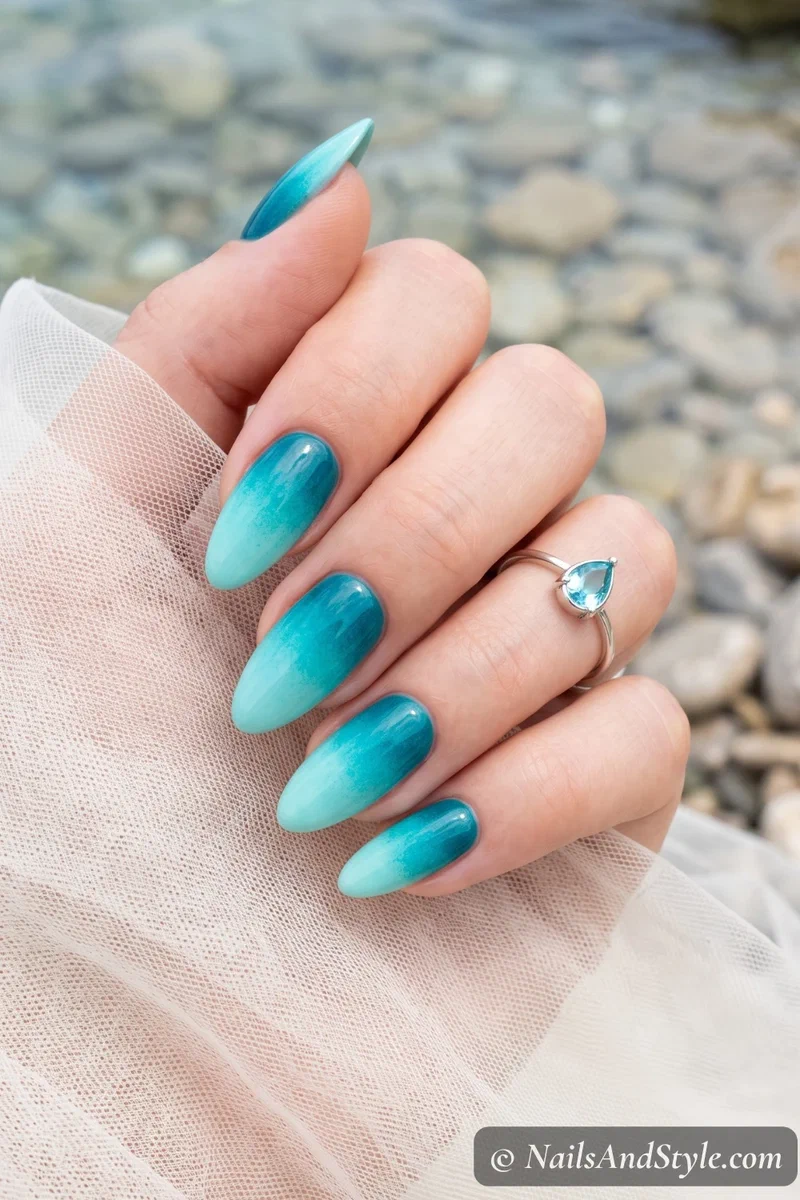 Multi-toned gradient nails blending turquoise, aqua, and teal